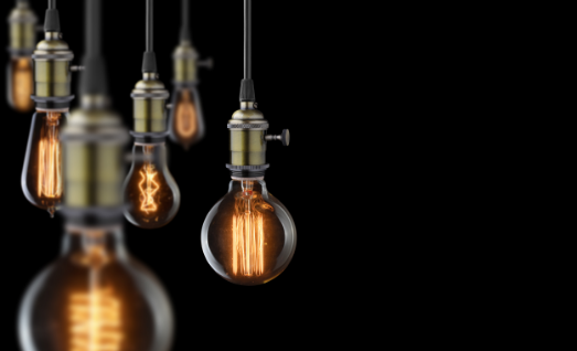 Hanging light bulbs with glowing filaments Hanging light bulbs with glowing filaments